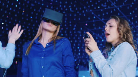 woman in a virtual reality helmet dancing at a disco 1