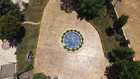 Overhead-Shot-Of-Beautiful-Water-Blue-Fountain-In-Front-Of-Castle,-Baissour,-Lebanon