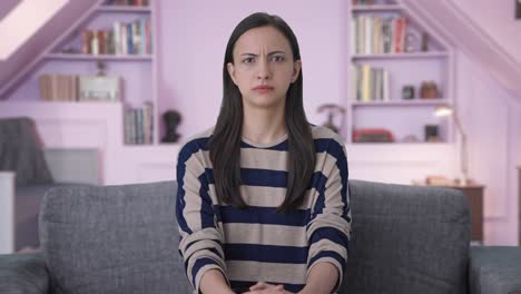 angry indian girl looking at the camera