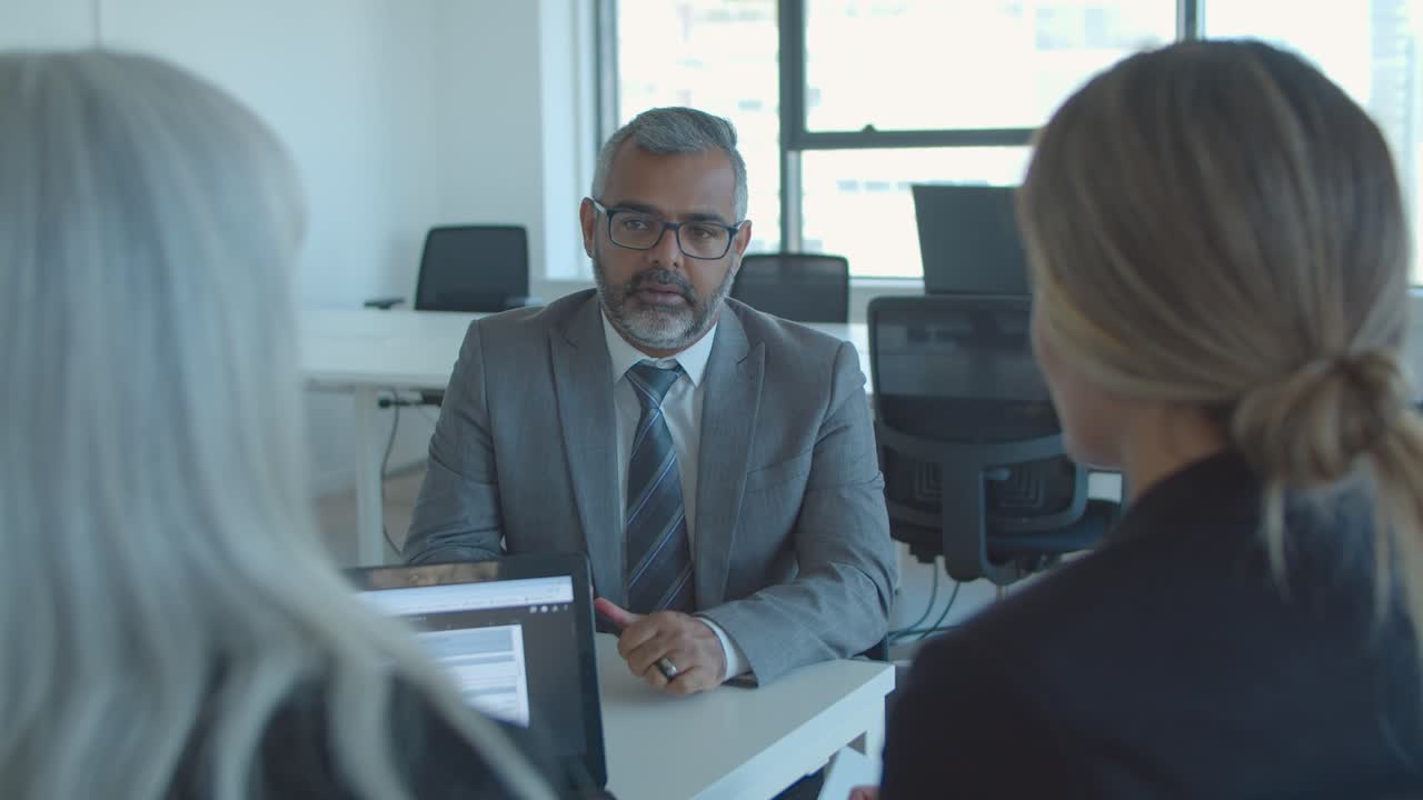 Serious mature male job candidate meeting