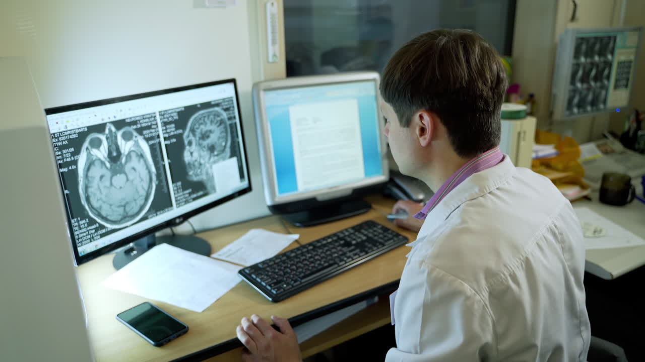 Doctor working at the hospital. Neurologist working on personal computer in modern laboratory