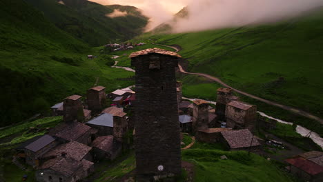 aerial view of ushguli community with svan towers and castle at sunset in georgia