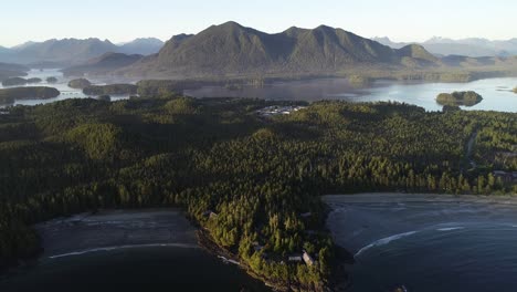 aerial view of vancouver island coastline and misty landscape on golden hour sun