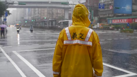 traffic officer in heavy rain in taipei