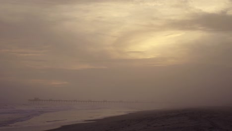 two beach-going tourists get swallowed up in a foggy storm surge on the crystal coast of emerald isle, nc time lapse