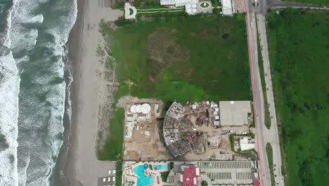 aerial above construction site near seaside beach at acapulco, mexico