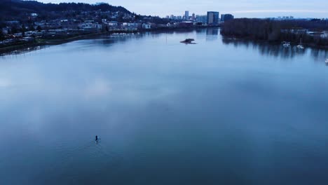 wide aerial shot paddle boarding on willamette river, portland oregon