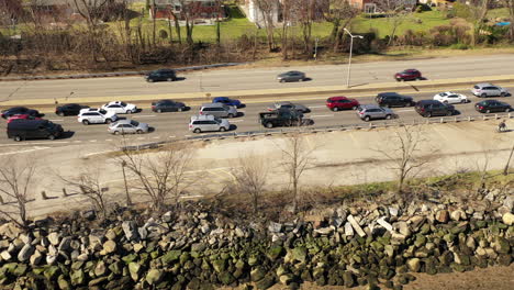 An-aerial-drone-shot-along-side-a-parkway-with-traffic-on-one-side-because-of-an-automobile-accident