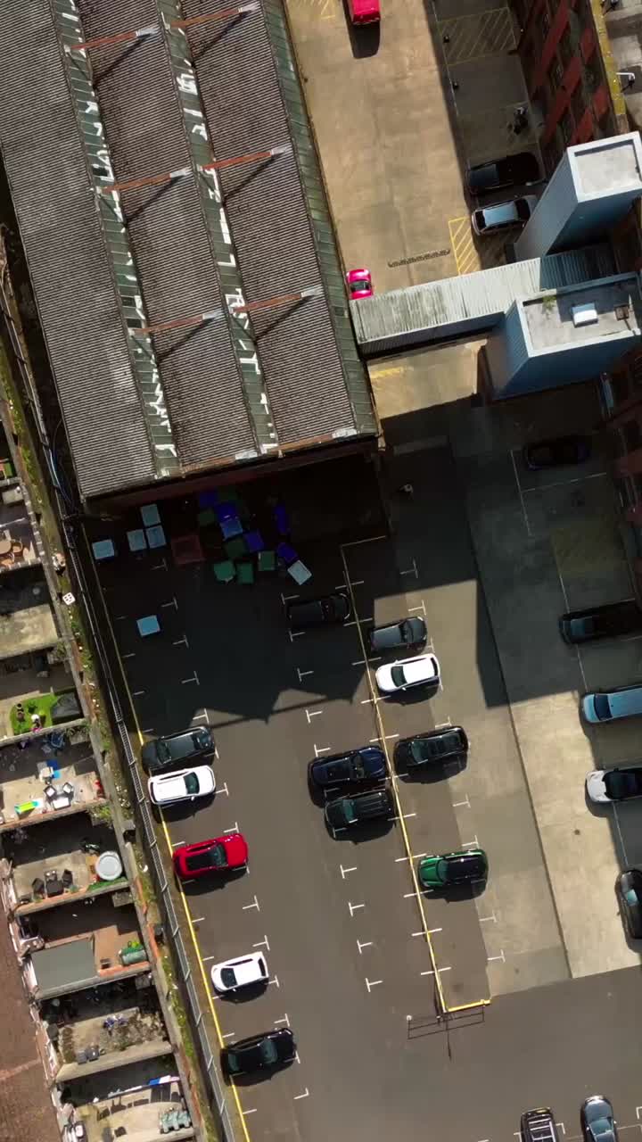 Overhead social ratio aerial GV of Portview Trade Centre in East Belfast, Northern Ireland, UK on a bright and sunny day. Produced in 4K, 60FPS and with Rec709 color
