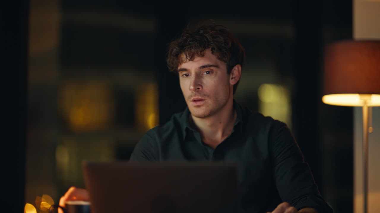 Businessman quarrelling smartphone night office closeup. Angry manager yelling