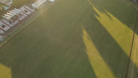 Polo-game-at-the-Argentine-Association-of-Polo-in-Buenos-Aires,-aerial-tilting-upward