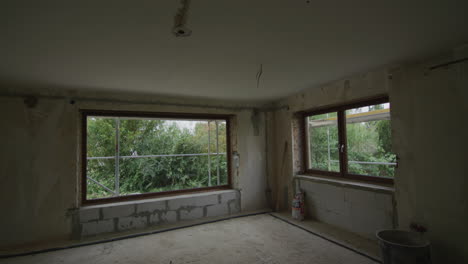 wide tracking shot of living room which gets renovated, new installation, new windows