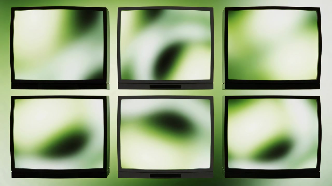 Avvio della riproduzione, sei monitor quadrati che mostrano una sfocatura verde e bianca che si trasforma lentamente su una parete dello studio.