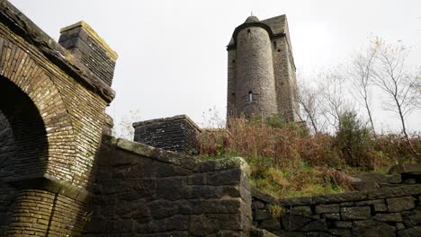 landmark rivington pigeon tower tall english rural autumn historic fairy tale building low angle left dolly