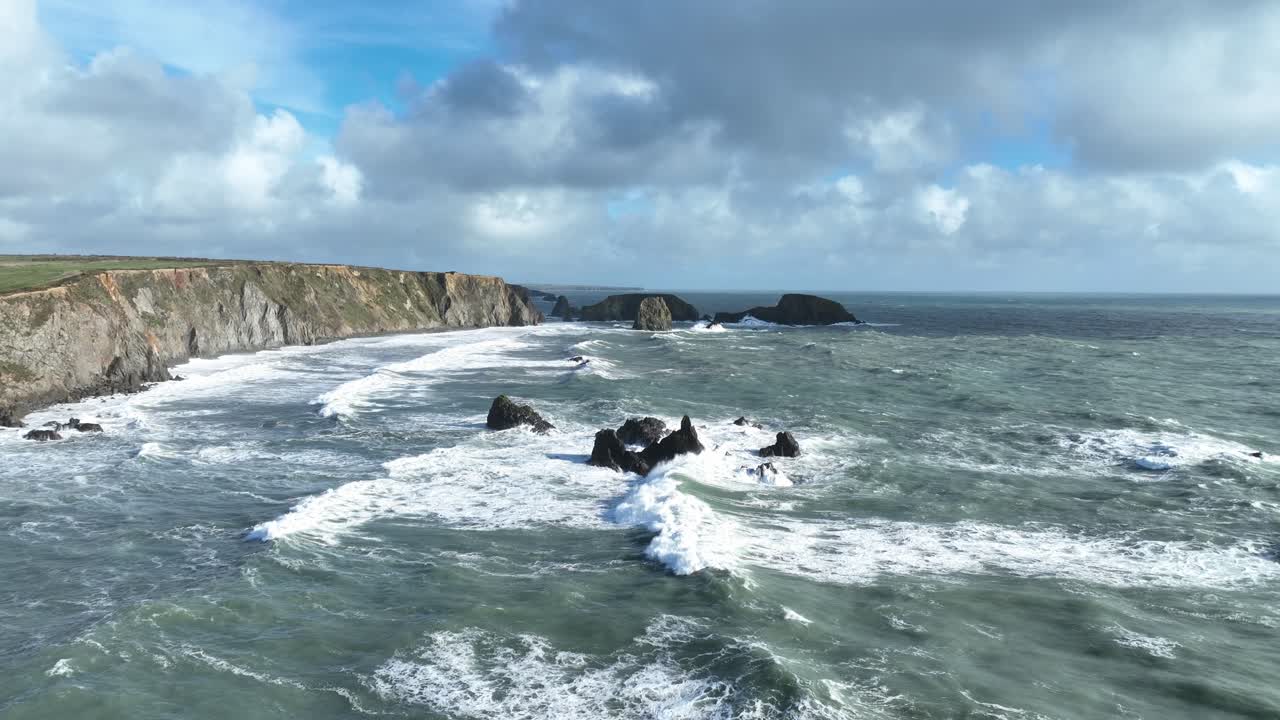 Epic Ireland drone flying over stormy seas large waves crashing on reef Copper Coast Waterford Wild nature