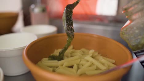 serving  delicious salsa in the noodles slowly