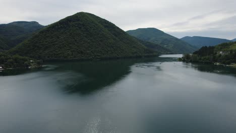 drone flyover along veliko plivsko lake, natural scenery landscape in bosnia and herzegovina