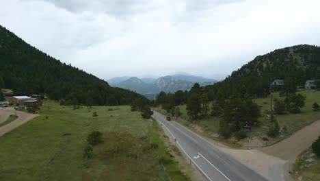 view of cars driving on two-lane country road