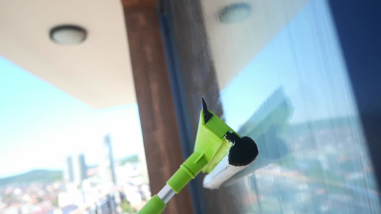 Window Cleaning with a Squeegee Tool