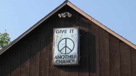 a brown barn with a peace sign in woodstock new york 2