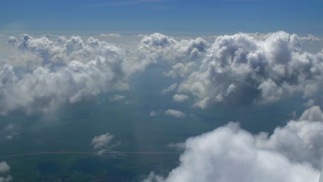 4k aerial paralax through clouds airplane flying