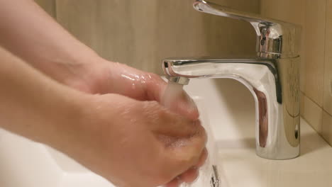 washing hands in the bathroom