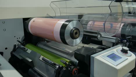 printing machine where a roll is raised where the rubber template is placed for only one ink-man working with printing industry machine