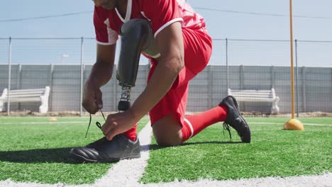 soccer player with prosthetic leg on field