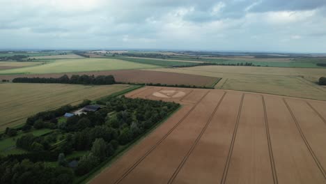 Cut-throat-razor-crop-circle-pattern-aerial-view-across-cast-Hackpen-hill,-Swindon-countryside-2023,-England