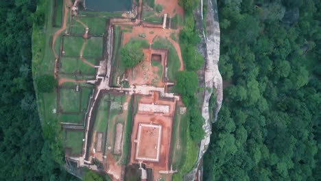 aerial forward view over sigiriya lions rock at sunset