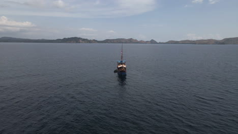 Pinisi-Boat-Sailing-On-Sea-Surface-In-Bali,-Indonesia