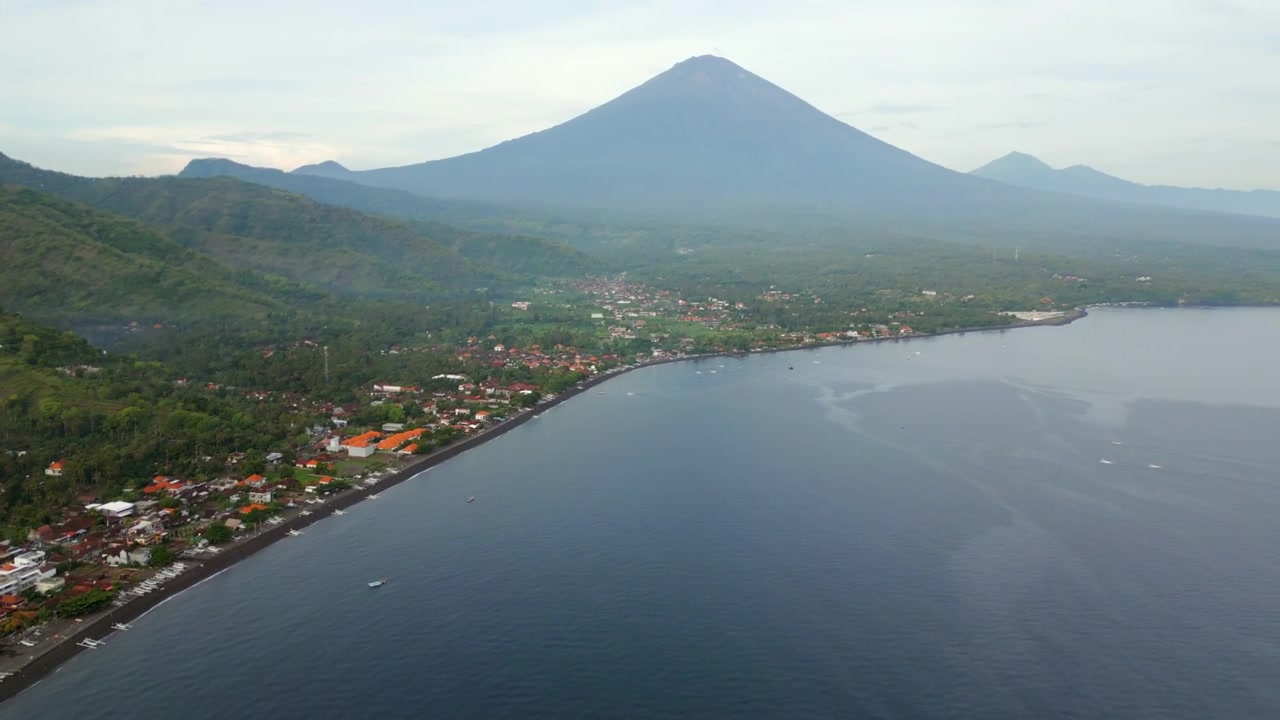 Peaceful Amed Beach Village And Mount Agung East Bali Indonesia Cinematic Drone Pan 4K 60FPS