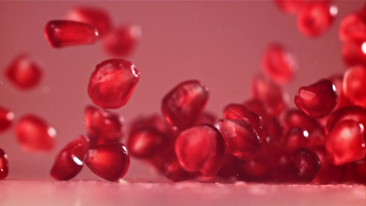 Pomegranate Seeds Falling and Bouncing in Slow Motion