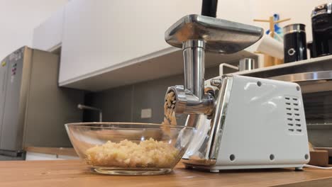 using a meat grinder in the kitchen