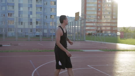 men playing basketball on an outdoor court