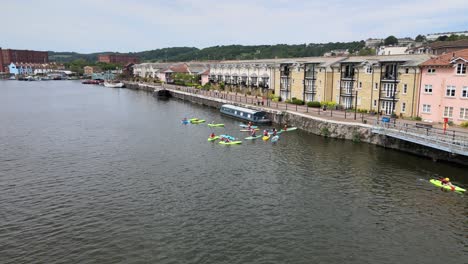 group of people in canoes on river avon bristol city uk drone footage