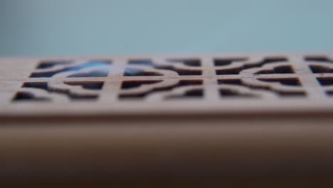 A-detailed-close-up-macro-shot-of-smoking-incense-in-a-wooden-box,-spiritual-ritual-meditation,-scented-therapy-fragrance,-relaxing-aromatic-white-smoke,-textured-case,-cinematic-static-4K-video