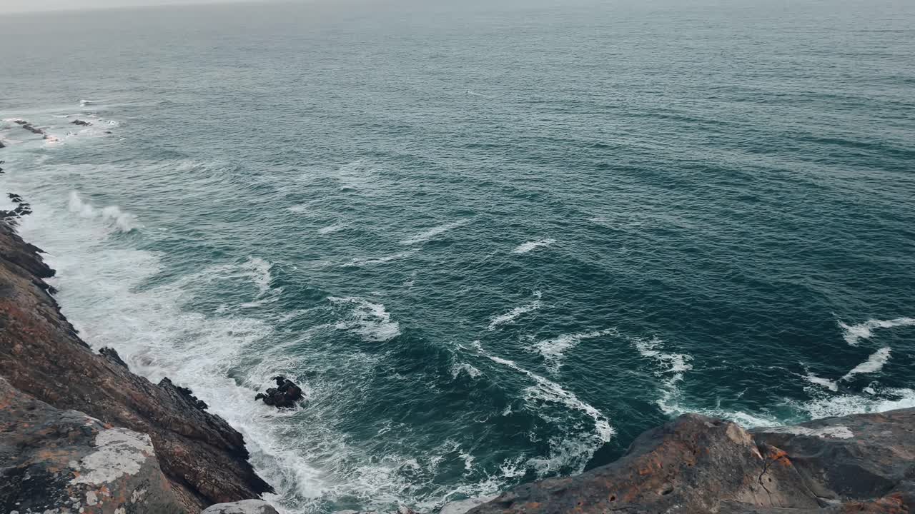 Over sight of ocean waves from a cliff in Mosselbay in South Africa