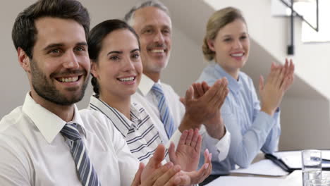 business people applauding together