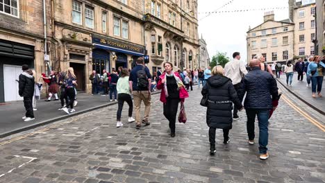 people walking on cockburn street, edinburgh, scotland