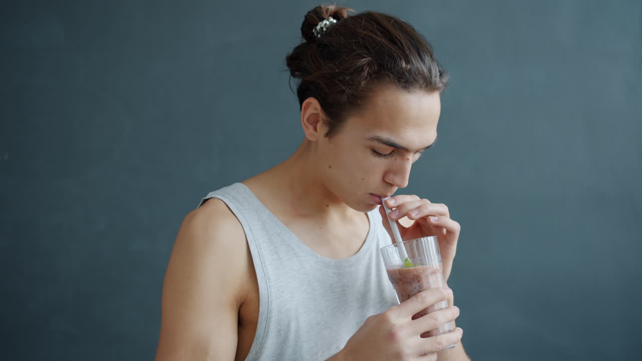 Young Man Drinking Smoothie