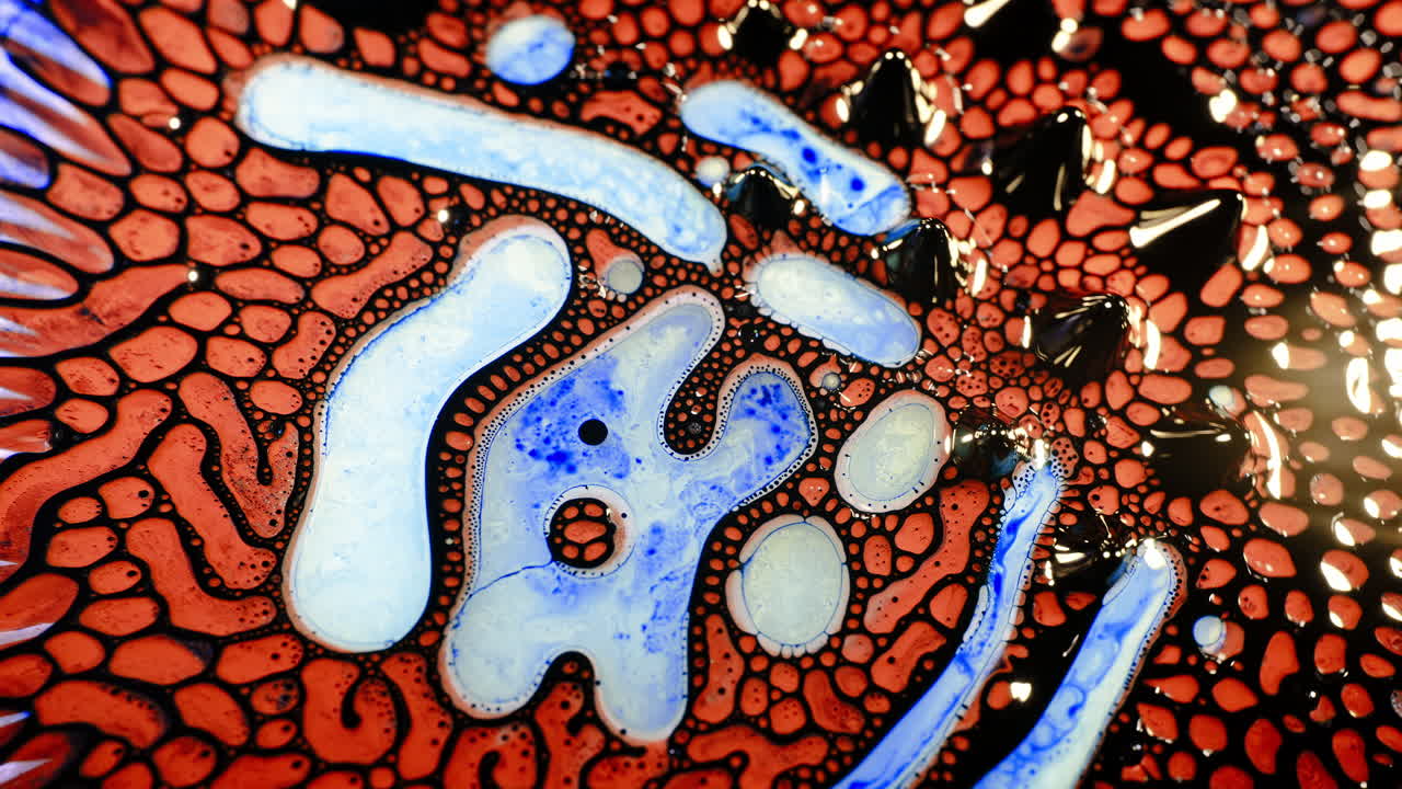 Abstract macro shot of colorful liquid patterns with organic textures and fluid motion