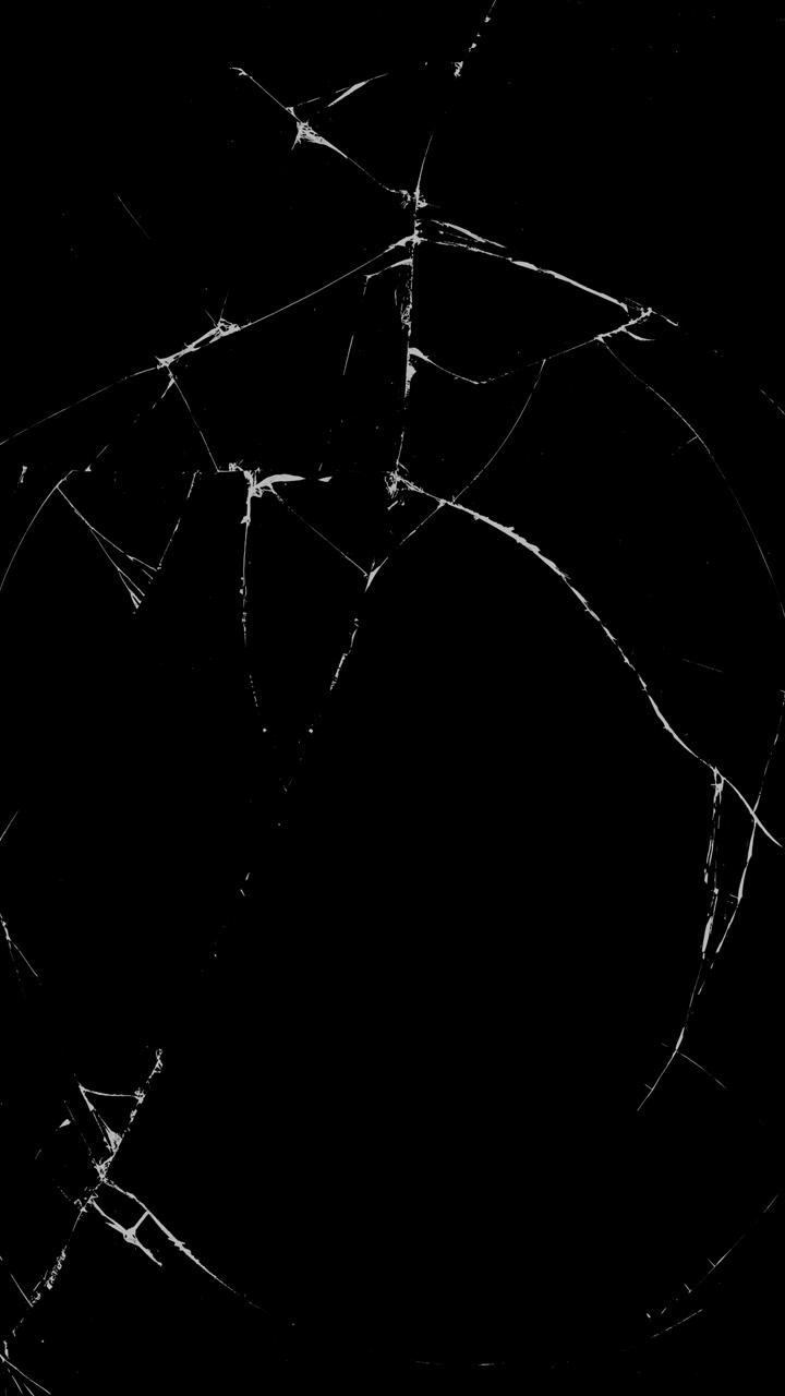Vertical format broken glass or cracked screen effect on black background for damage transitions