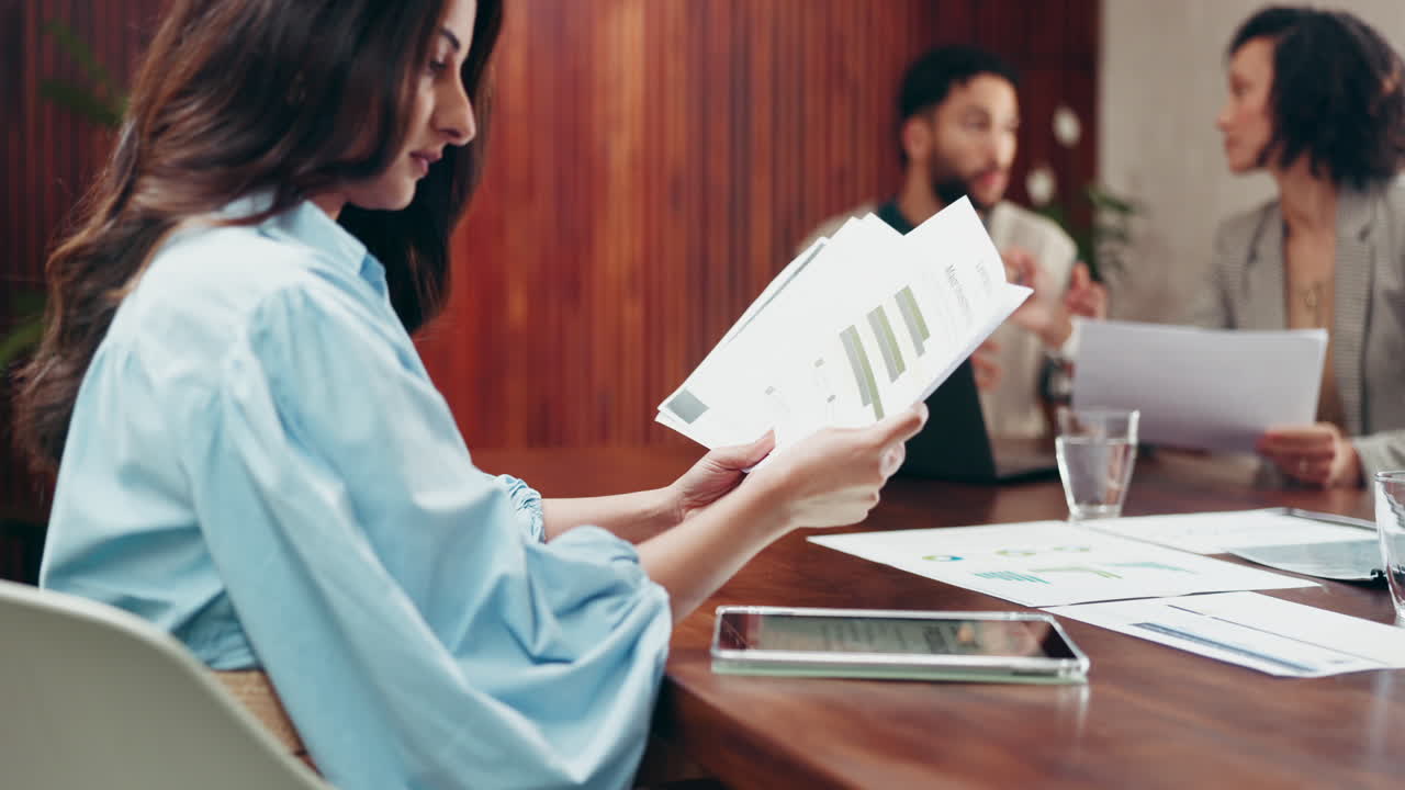 Team Analyzes Financial Data in Business Meeting