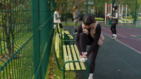 woman tying her shoelaces