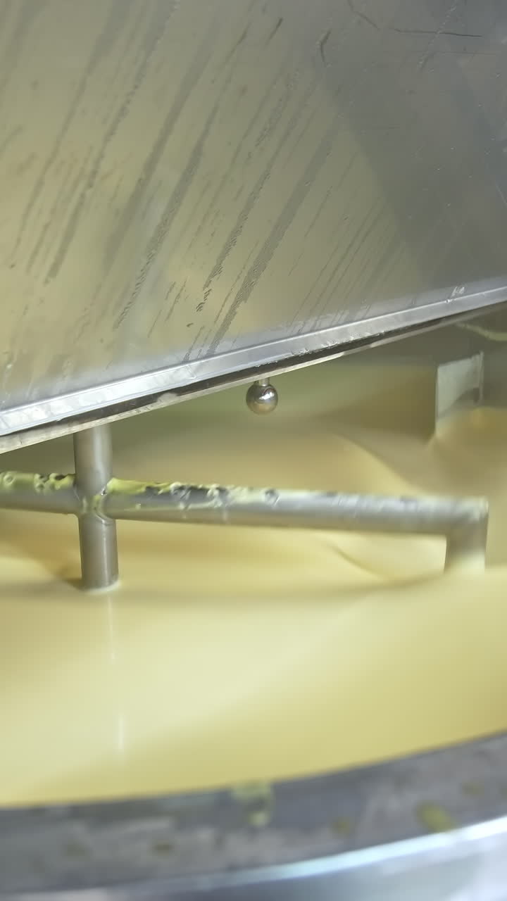 Butter production line at dairy industry. Close up view of butter production at dairy plant