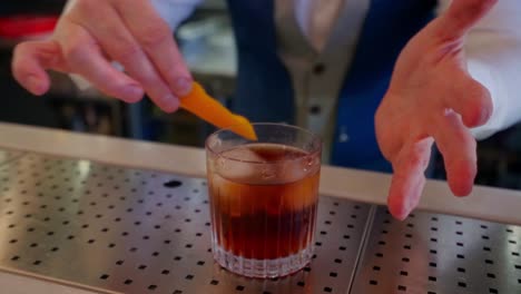 bartender prepares a mixed rum cocktail