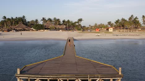 Drone-Follow-Latina-women-in-swimsuit-on-Margarita-Coche-Island-in-Venezuela