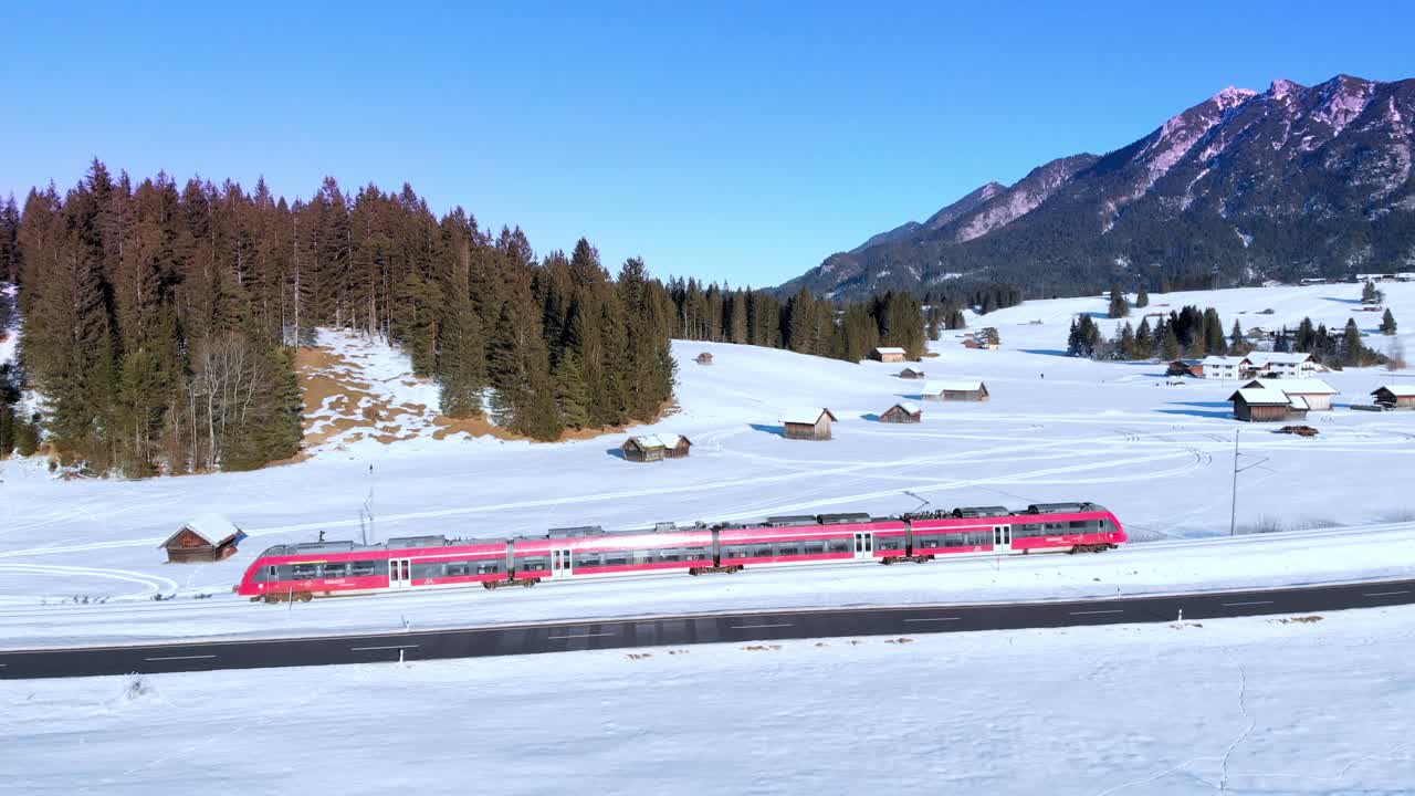 Aerial: train near Mittenwald with the Karwendel mountains as a background