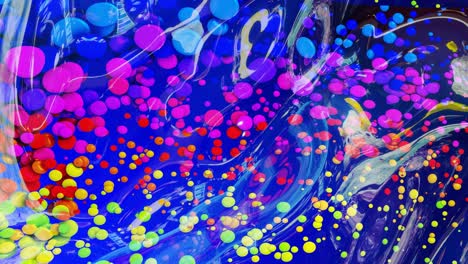 abstract looped background of shiny glossy surface like wavy blue liquid with rainbow color circles float like drops of paint in oil. beautiful creative background with color gradient in 4k. 3d